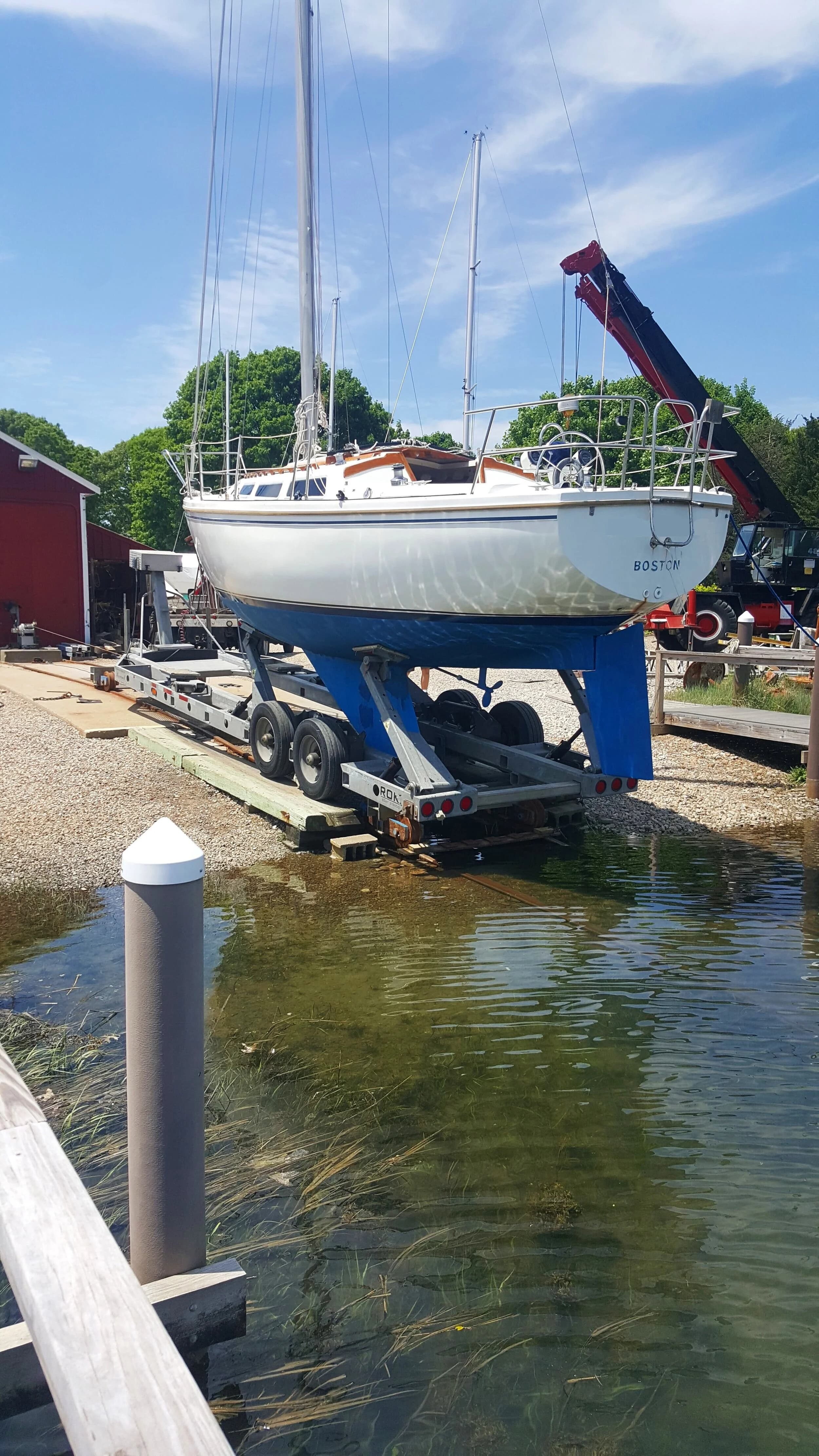 Boats hauled and blocked in the storage yard at Scallop Bay Marina